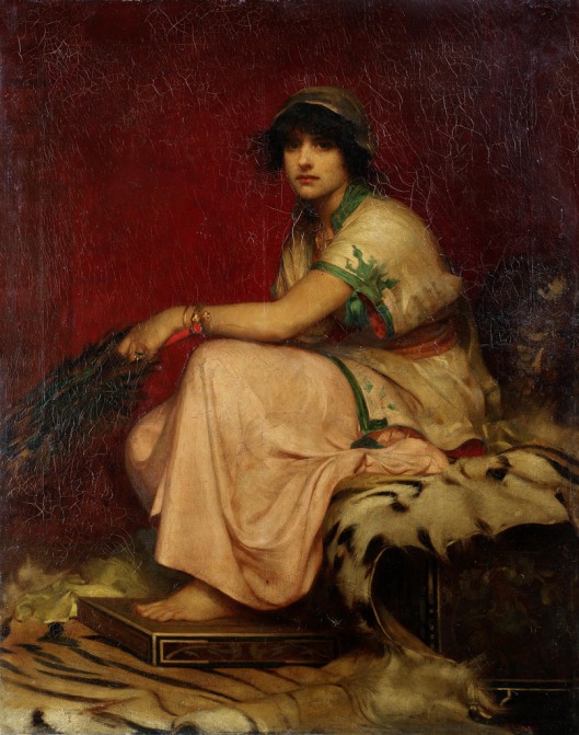 A classical lady, seated on a tiger skin rug